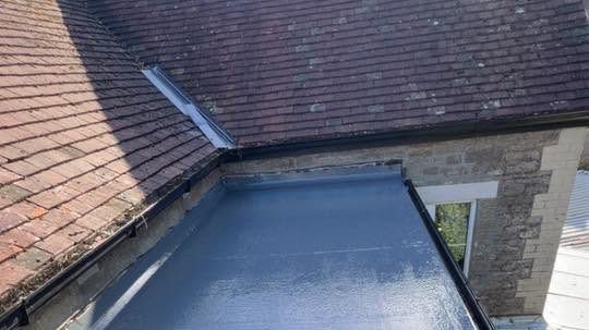 After: new CROMAR GRP fibreglass flat roof with a grey UV-resistant topcoat in Somerset by Somerset Roofline Care