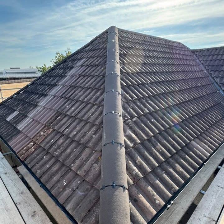 After: ridge and hips re-bedded with clean new mortar in Wincanton by Somerset Roofline Care